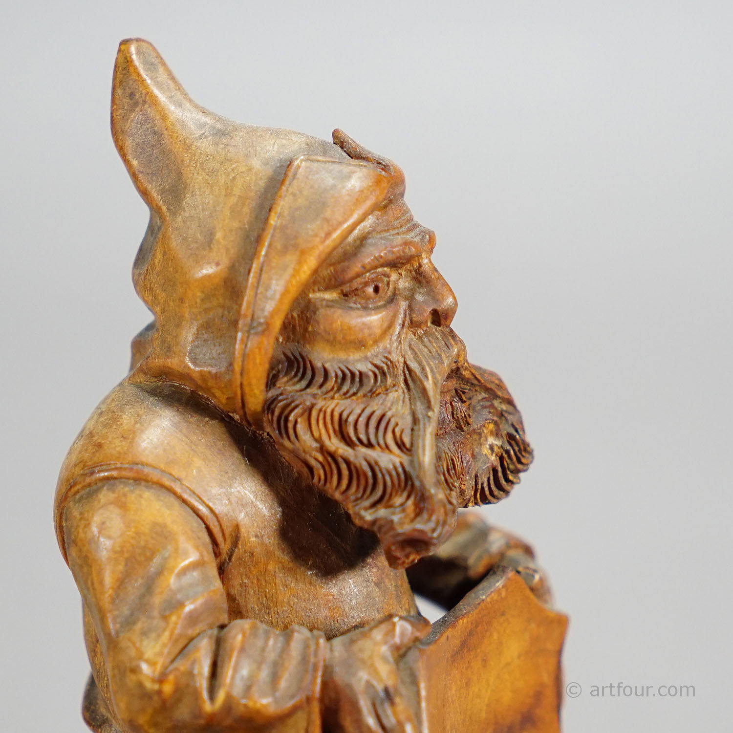 Wooden Carved Black Forest Dwarf Sitting on a Three Stump
